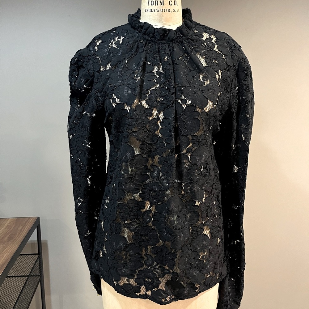 Wayf puff sleeve lace blouse. Ruffled neckline and sleeve, keyhole, button back